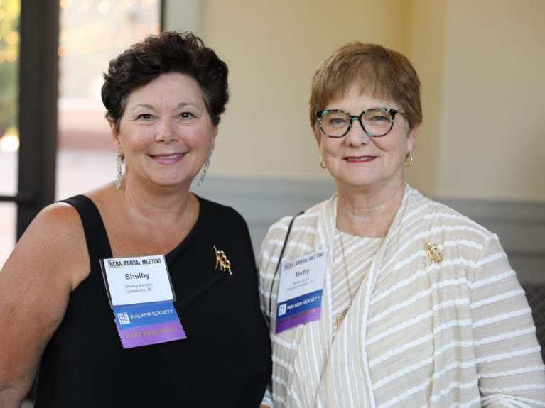 Two women smiling at camera