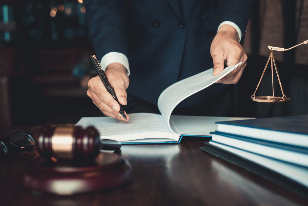 Justice and law concept. Gavel on sounding block in hand's Male